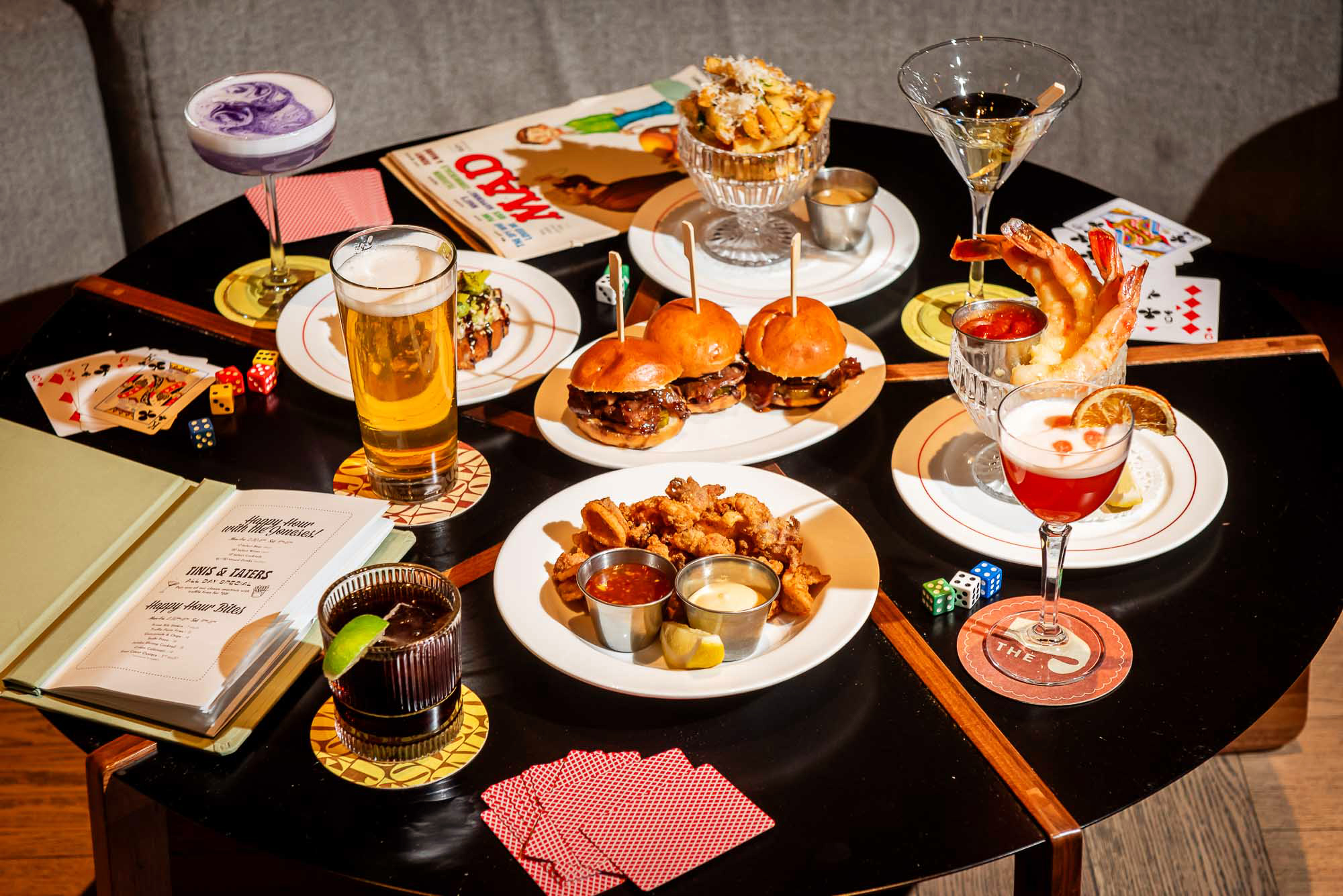 a table set with happy hour dishes